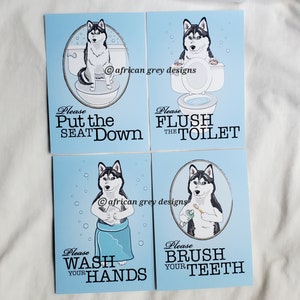 May include: Four blue bathroom signs with a cartoon husky dog on each. The signs say "Please Put the Seat Down", "Please Flush the Toilet", "Please Wash Your Hands", and "Please Brush Your Teeth".
