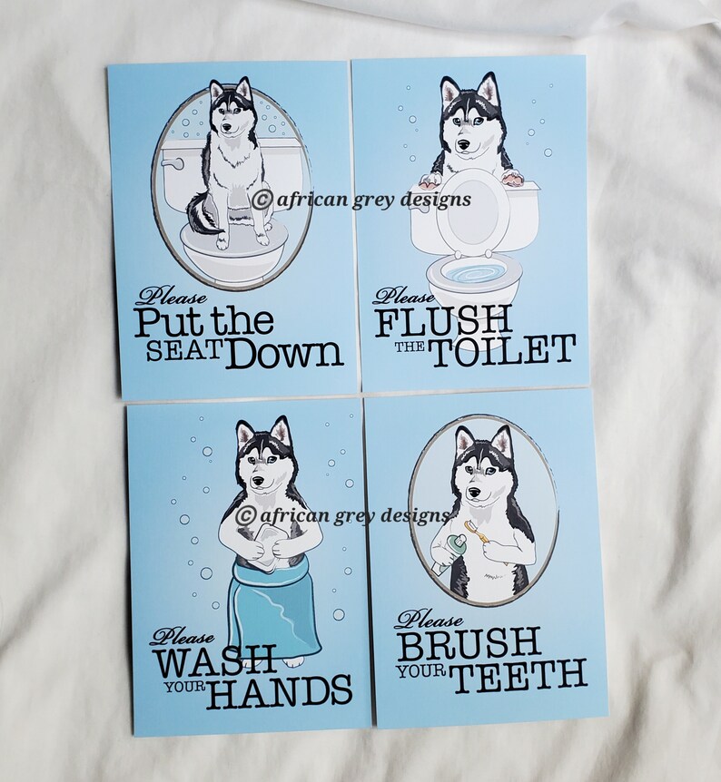 May include: Four blue bathroom signs with a cartoon husky dog on each. The signs say "Please Put the Seat Down", "Please Flush the Toilet", "Please Wash Your Hands", and "Please Brush Your Teeth".