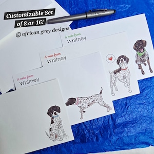 May include: A customizable stationery set featuring white notecards with German Shorthaired Pointer illustrations. The set includes a pen and the text "Customizable Set of 8 or 16!" and "A note from Whitney". The stationery is on a blue surface.