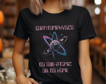 May include: Black t-shirt with a pink and blue atom graphic and the text "QUANTUMPHYSICS GO SUB-ATOMIC OR GO HOME".