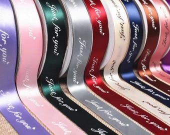 May include: A collection of satin ribbons in various colors including purple, pink, dark green, silver, red, cream, navy blue, brown, and light pink. Each ribbon features the repeating white cursive text "Just for you" with a small heart icon.