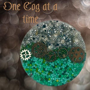 May include: A circular artwork with the text "One Cog at a time." The piece features a gradient of colours, with green beads at the bottom and silver and clear beads at the top. Several metal gears are embedded within the artwork.