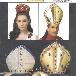 May include: A Butterick pattern B5441 featuring historical costume headwear. The image displays various crowns and miters, including a red crown with white accents and a gold miter with red jewels. The text "Butterick" and "Making History" are visible.