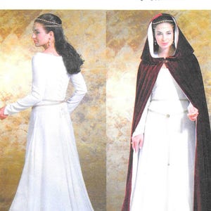 May include: Butterick sewing pattern B4377 for a long-sleeved white floor-length dress with a thin metallic belt and a dark red velvet hooded cloak. The pattern envelope displays the text B4377 Butterick and size range EE 14-16-18-20.
