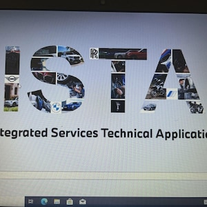 May include: A computer screen showing the word "ISTA" formed from car images and logos. The text "Integrated Services Technical Application" is below. The background is light grey with a blue gradient on the right.