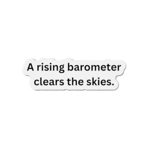 May include: White sticker with the text "A rising barometer clears the skies." The text is in a black, sans-serif font. The sticker has a white border and a slightly irregular shape.