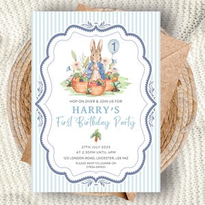 May include: A light blue and white striped invitation for Harry's First Birthday Party. The invitation features a watercolor illustration of a rabbit, baskets of vegetables, and a balloon. The text includes the date, time, and location.