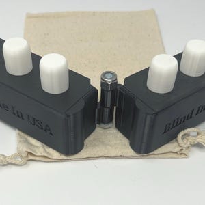 Swing cell for the blind, learn to write with the perkins brailler, practice braille cell, pegs represent dots and braille writer keys