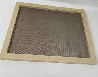 May include: A light wood frame with a brown mesh screen insert. The frame is approximately 12 inches by 16 inches.