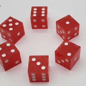 May include: Six translucent red six-sided dice arranged in a circular pattern. Each die features white circular pips representing numbers one through six. The number 7 is printed in black in the upper left corner of the image frame.