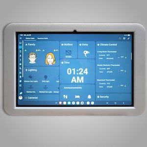 May include: A digital tablet with a blue interface, displaying smart home controls. The screen shows time, family, lighting, and climate control options. The tablet is set in a white frame.