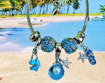 Handcrafted beach themed charm bracelet, swimsuit, flip flop, seashell and starfish charms with crystals