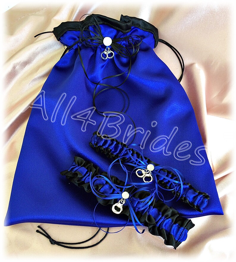 handcuff charms bridal garter set and money dance bag. Thin blue police wedding leg garter set and drawstring bag
