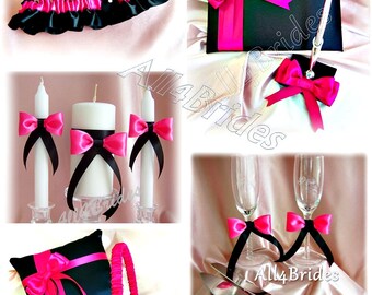 Hot pink and black wedding pillow, basket, guest book, pen, candles, cake set, toasting glasses and bridal garter set