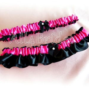 Hot pink and black wedding bridal keepsake and toss leg garter set.