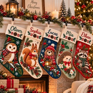 May include: Five personalised Christmas stockings hanging in a row, each featuring a cream-coloured cuff with a name: Oliver, Sophia, Lucas, Mia, and Ethan. The stockings display woodland animals including an owl, squirrel, bear, hedgehog, and raccoon.