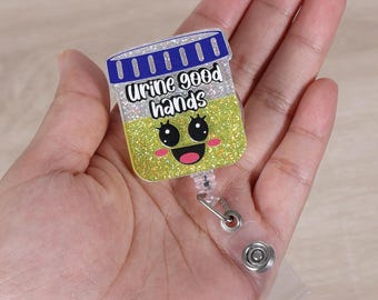 Porta credencial retráctil con diseño de orina y buenas manos, ideal para urología, nefrología pediátrica y enfermería.