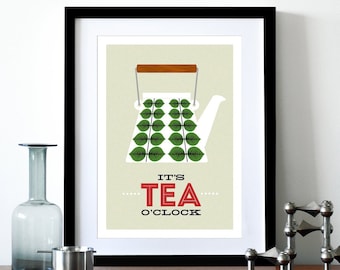May include: A framed print featuring a white teapot with a green leaf pattern. The text "It's Tea O'Clock" is displayed beneath the teapot.