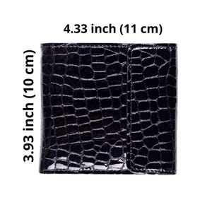 A glossy black wallet with a crocodile skin texture. The wallet is rectangular, measuring 4.33 inches (11 cm) wide and 3.93 inches (10 cm) tall. It has a snap closure on the right side.