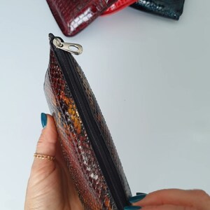 Small thin leather zippered make up bag