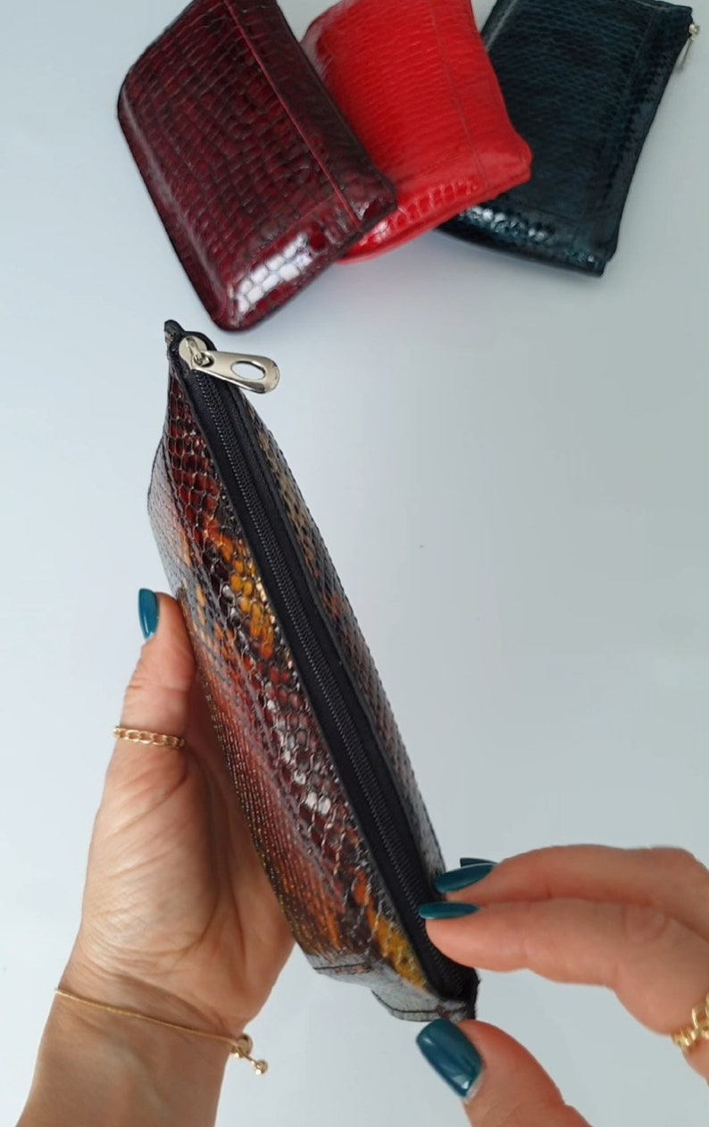 Small thin leather zippered make up bag