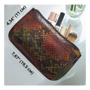 The bag is 7.67 inches (19.5 cm) wide and 4.34 inches (11 cm) tall.