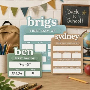 May include: Three custom acrylic school milestone signs in sage green, light blue, and tan. The signs feature white raised lettering with names 'ben', 'brigs', and 'sydney', and blank fields for date, age, height, and interests. The 'ben' sign shows 'Pre-K', '8/23/24', and '4'.