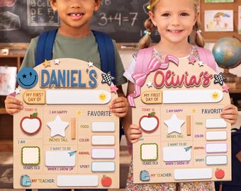 May include: Two personalized wooden first day of school signs featuring arched tops, blank fields for names, grade, age, teacher, and favorites. The signs include colorful graphics of apples, stars, backpacks, and suns with text labels for school milestones.
