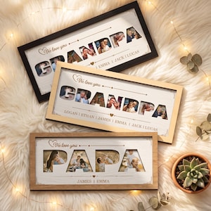Op de afbeelding: Drie ingelijste fotodisplays met de woorden "Grandpa" en "Papa" uitgesneden om familiefoto's te onthullen. De frames zijn zwart, licht hout en donker hout. De tekst "We love you" staat boven de uitgesneden letters.