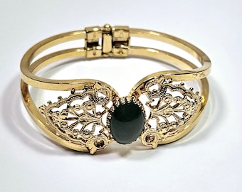 Vintage gold filigree hinged bangle bracelet with green stone setting cabochon unsigned designer mid century cuff