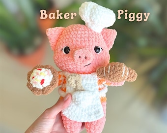 May include: A crochet plush toy of a pink pig wearing a white chef hat and apron. The pig holds a brown pastry in one hand and a small round treat with colorful sprinkles in the other. The text PDF Pattern Baker Piggy is visible above.