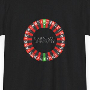 May include: Black t-shirt with a red and green roulette wheel graphic and the text "DEGENERATE UNIVERSITY" printed on the back.