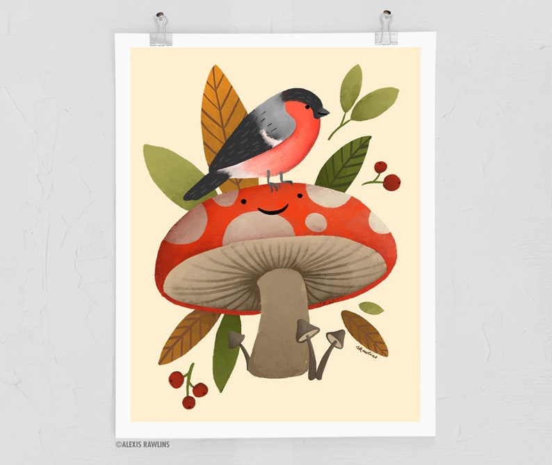 May include: A red and white mushroom with a smiling face, topped with a small grey and red bird, surrounded by green and brown leaves.