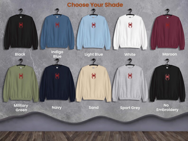 May include: Ten different colour sweatshirts with a red spider graphic on the front. The colours are black, indigo blue, light blue, white, maroon, military green, navy, sand, sport grey, and no embroidery.