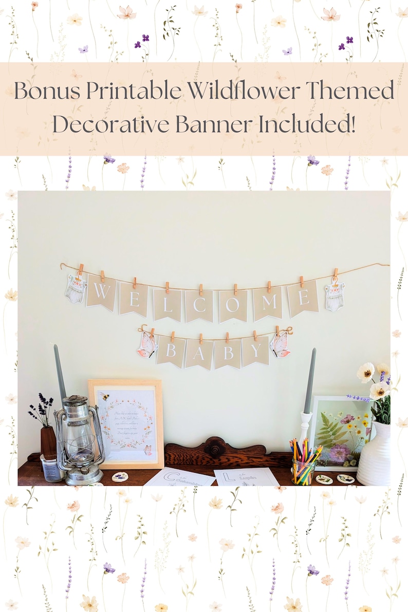 May include: A decorative banner with the words "WELCOME BABY" is strung across a wall. The banner is made of tan pennants with white letters, and is decorated with baby-themed illustrations. The image also includes a framed print and other decorative items.