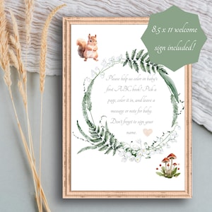 Peut inclure: Un panneau de bienvenue encadr&eacute; de 21,6 x 27,9 cm avec un design &agrave; l'aquarelle. Le panneau pr&eacute;sente un &eacute;cureuil, une couronne florale et un texte qui dit : "Aidez-nous &agrave; colorier le premier livre ABC de b&eacute;b&eacute; !" Le panneau est dans un cadre en bois.
