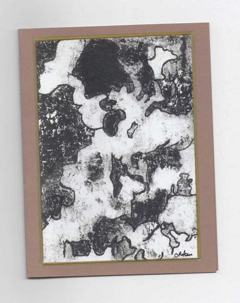 May include: Black and white abstract art print with a textured look. The print is framed with a brown mat and a gold border. The artist's signature is in the bottom right corner.