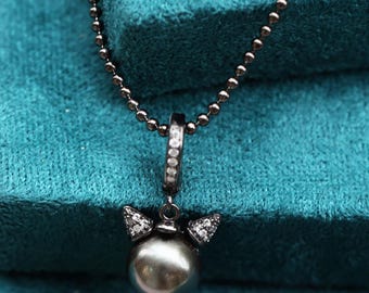 Collar de ángel diablo con perla negra de Tahití, joyería artesanal de plata de ley.