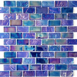 May include: A sheet of iridescent blue and purple glass mosaic tiles. The tiles are arranged in a brick pattern and have a textured surface.