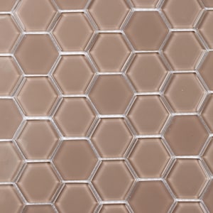 May include: A sheet of brown hexagonal glass mosaic tiles. The tiles are arranged in a staggered pattern.
