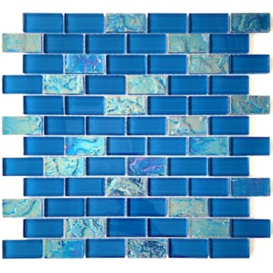 May include: A sheet of iridescent blue glass mosaic tiles in a brick pattern. The tiles have a subtle, marbled effect.