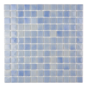 May include: A sheet of small, square, light blue mosaic tiles with a gradient effect, transitioning from a lighter shade of blue to a darker shade of blue.