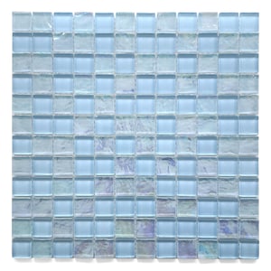 May include: A sheet of light blue iridescent glass mosaic tiles. Each tile is square shaped and measures approximately 1 inch by 1 inch.
