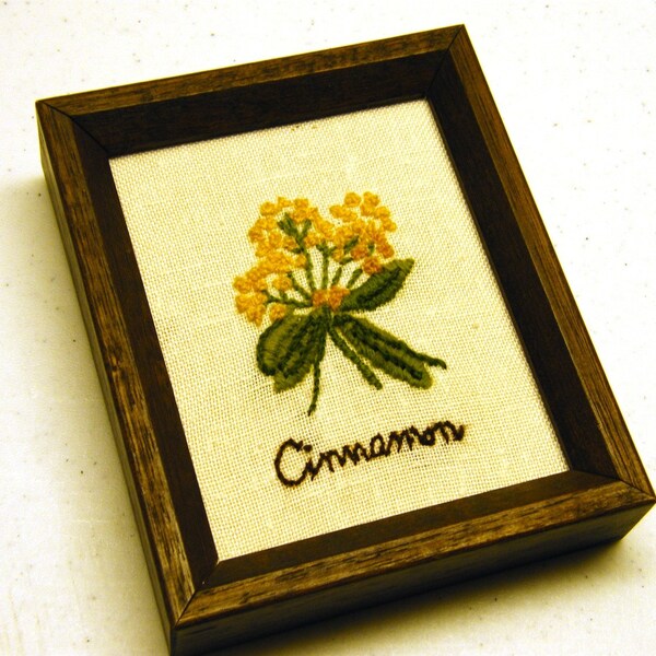 Cinnamon Needlework in square wood frame