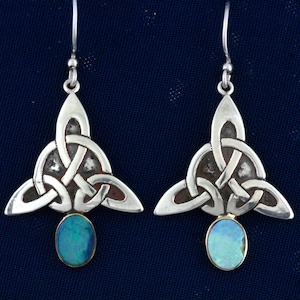 May include: Silver Celtic knot earrings with blue opal stones.
