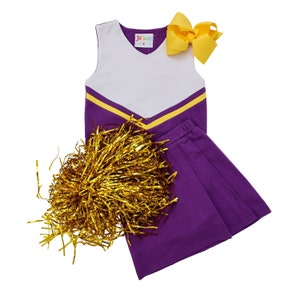 May include: Purple and gold cheerleading outfit with a white top, a purple skirt, and a gold pom-pom.