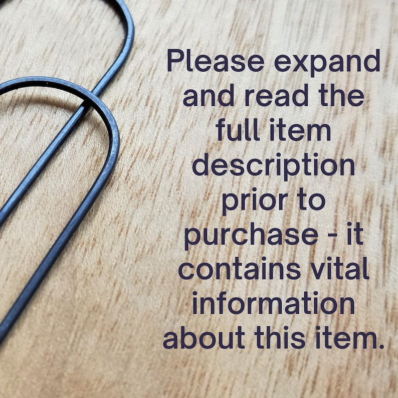 May include: Text on a wooden surface that reads: "Please expand and read the full item description prior to purchase - it contains vital information about this item."