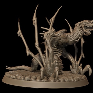 May include: A detailed, beige-colored figurine of a creature with a skeletal appearance, featuring multiple limbs and a menacing open mouth. The creature is posed on a textured, circular base, set against a black background.