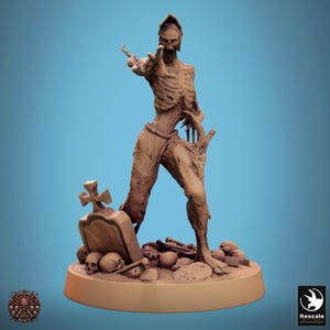 May include: A detailed figurine of a skeletal figure reaching forward, with a weathered appearance. The figure stands on a base with a tombstone, skulls, and bones. The color palette is primarily shades of brown and tan, with a blue background.