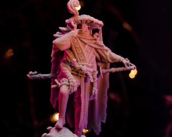 May include: A white 3D printed figurine of a person wearing a mushroom hat and a long robe. The figurine is standing on a base with a mushroom design.